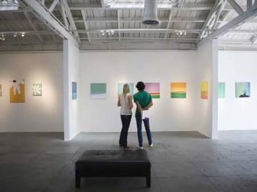 two people standing in art gallery